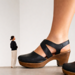 Audience Enchanted by Curator's Footwear at MoMA Event