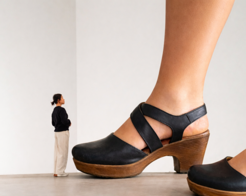 Audience Enchanted by Curator's Footwear at MoMA Event